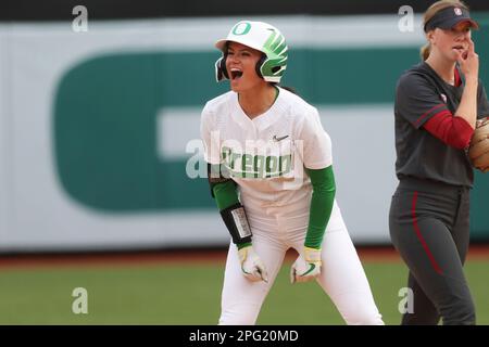 SEATTLE, WA - APRIL 17: Oregon Ducks catcher Terra McGowan (11) throws the  ball to first during a college softball game between the Oregon Ducks and  the Washington Huskies on April 17