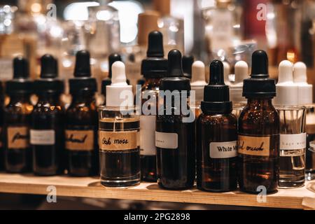 Mockup brown glass bottles with pipettes. Smell of essential fragrance oil. Perfume tester miniatures Stock Photo