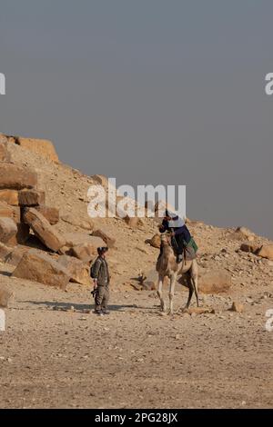 Egypt, Dashur, Sneferu's Bent Pyramid, tourist and camel. Stock Photo