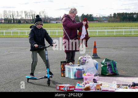Mother and son  shopping at a local car boot sale and flea market, Ayr, Ayrshire, Scotland, Stock Photo