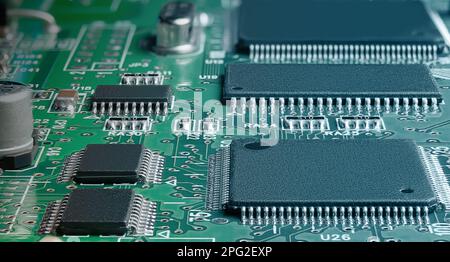 electronic circuit board with passive and active circuit components and IC close-up Stock Photo