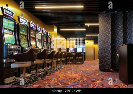 Nikolaev, Ukraine, - October 21, 2021: slot machines of the casino 'First' in the hotel 'Green Day'. Deluxe Game Club in the hotel. Stock Photo