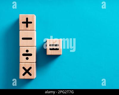 Basic mathematical operations symbols. Plus, minus, multiply, divide and equal symbols on wooden cubes. Mathematic or math education and basic calcula Stock Photo