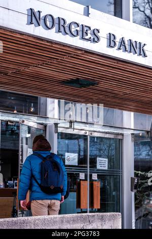 Stavanger, Norway, March 10 2023, Man Entering A Branch Of Norges Bank In Downtown Stavanger Stock Photo