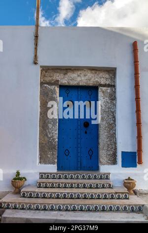 The Blue Arabesque Door of an Ancient Arabesque-Style House. Tunisia Stock Photo