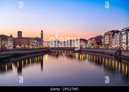 Pisa, Italy skyline on the Arno River at dusk. Stock Photo