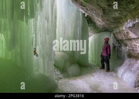 Karen Rentz behind the spectacular ice formations of Eben Ice Caves