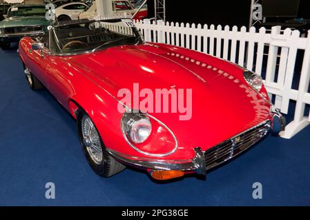 Three-Quarters Front View of a Red, 1974, Jaguar E-Type Series III Roadster, part of the 2023 London Classic Car Auction at Olympia, London Stock Photo
