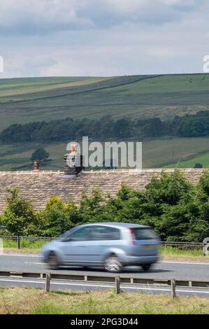 Stott Hall Farm, Rishworth, a farm in the middle of the M62 motorway, Yorkshire, England Stock Photo