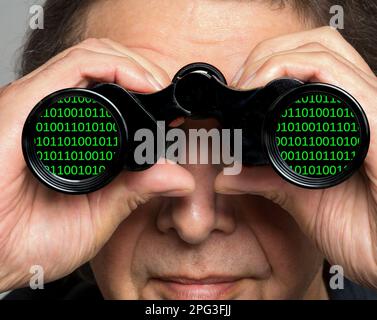 Binary code in binoculars. Stock Photo