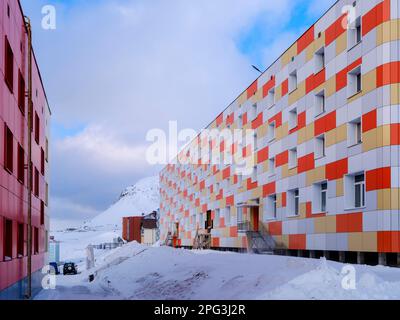 Residential area for the miners. Russian coal mining town Barentsburg at fjord Groenfjorden, Svalbard. The coal mine is still in operation. Arctic Reg Stock Photo