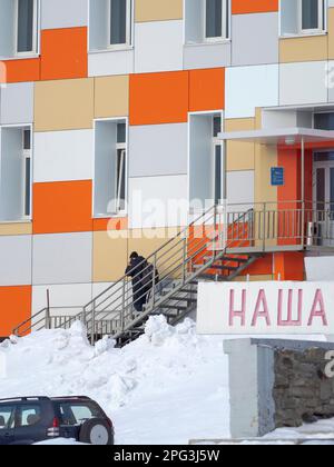 Residential area for the miners. Russian coal mining town Barentsburg at fjord Groenfjorden, Svalbard. The coal mine is still in operation. Arctic Reg Stock Photo