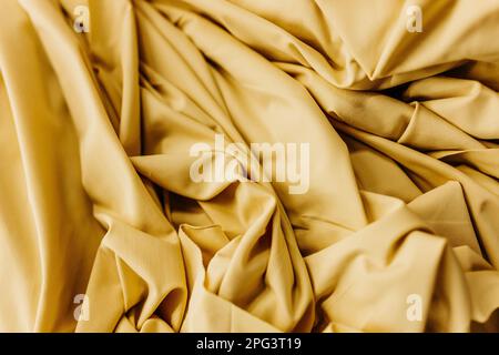 A closeup of a soft brown fabric swatch background Stock Photo