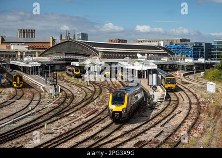 Great Western Railway and Crosscountry trains stand at the platforms under the train shed of Bristol's main Temple Meads station. Stock Photo