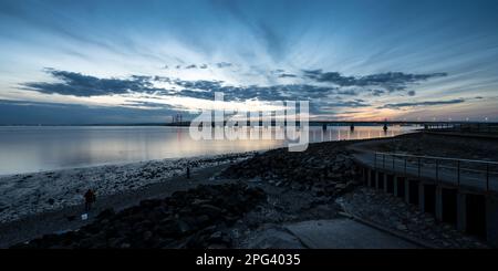 The sun sets over the Second Severn Crossing bridge at Severn Beach in Bristol. Stock Photo