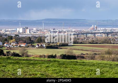 The industrial cityscape of Avonmouth Docks in Bristol, with the M5 Avonmouth Bridge in front, and the Severn estuary, M4 Second Second Crossing, and Stock Photo