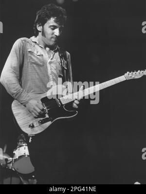 American signer, songwriter Bruce Springsteen playing guitar on stage during a concert Stock Photo