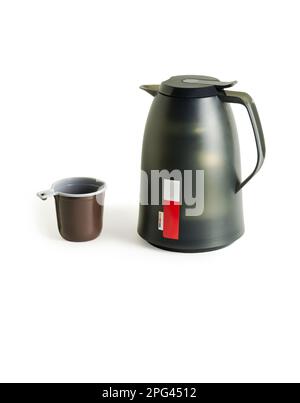 Thermos and plastic cup. Dark green thermos with a handle. Close-up. Isolated on white background. Stock Photo