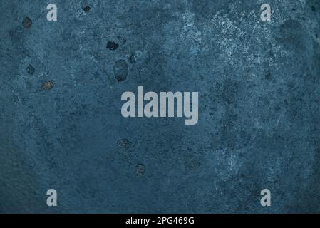 close up of old and gritty black cast iron metal - abstract background Stock Photo