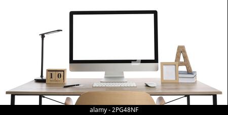 Wooden table with modern computer, decor and stationery on white background Stock Photo