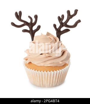 Delicious Christmas cupcake with chocolate reindeer antlers isolated on white Stock Photo