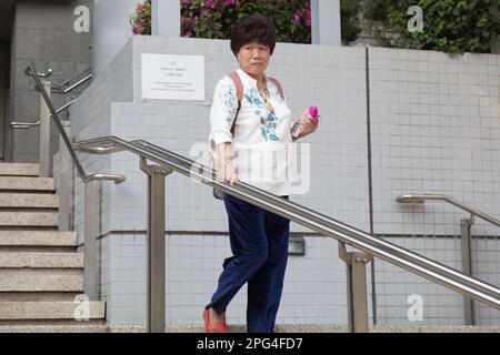 Christina Tang Yuen-ching, a former assistant to ex-lawmaker HHong HairHHLeung Kwok-hung, is found guilty of collecting donations without a permit under the Summary Offences Ordinance at Kowloon City Court. Tang and League of Social Democrats chairwoman Chan Po-ying had set up a street booth on a footbridge on Sai Yee Street to rally public support and urge authorities to 'release political prisoners' in Mong Kok on July 24, 2021.  16MAR23 SCMP/ Brian Wong Stock Photo