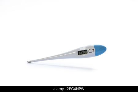 Electronic body thermometer displaying healthy human body temperature 36.6 degrees C (Celsius). isolated on white background Stock Photo