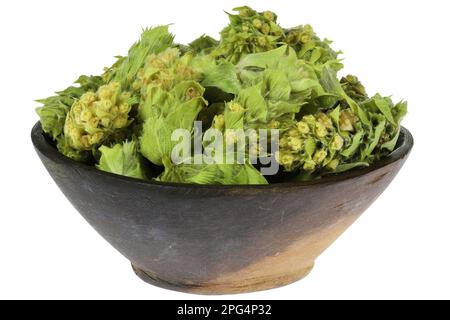 Greek Mountain Tea in a wooden bowl isolated on white background Stock Photo