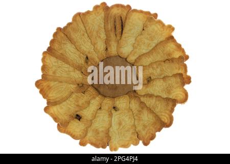 handmade speculoos cookies on a wooden plate isolated on white background Stock Photo