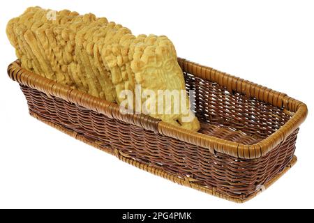 handmade speculoos cookies in a rattan basket isolated on white background Stock Photo
