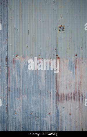 Rusty old tin sheet storage building Stock Photo