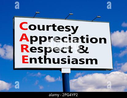 CARE symbol. Concept words CARE courtesy appreciation respect and enthusiasm on big billboard against beautiful blue sky. Business CARE courtesy appre Stock Photo