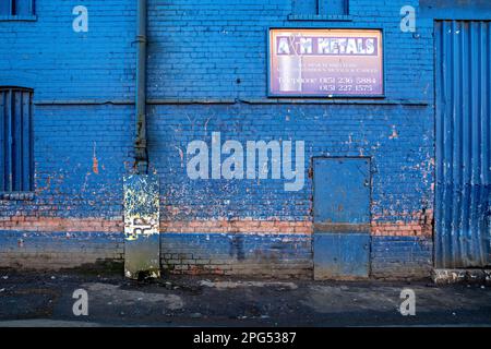 Blue painted facade to Liverpool dockland warehouse Stock Photo