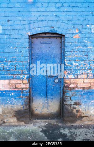 Blue painted facade to Liverpool dockland warehouse Stock Photo