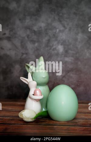 Happy Easter. Congratulatory easter background. Easter bunnys egg and flower Stock Photo