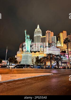 Las Vegas, Nevada - March 14, 2023 - New York New York at night with lit up rollercoaster and Statue of Liberty on the Las Vegas Strip Stock Photo