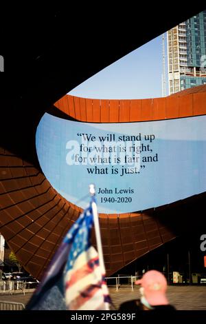 John Lewis Quote on digital sign with American flag in foreground, Barclays Center, Brooklyn, New York City, New York, USA Stock Photo