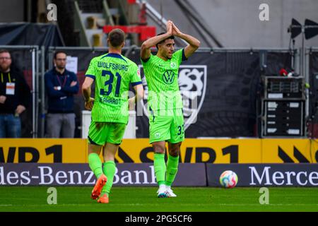 Stuttgart, Germany. 18th Mar, 2023. Soccer: Bundesliga, VfB Stuttgart - VfL Wolfsburg, Matchday 25, Mercedes-Benz Arena. Wolfsburg's Omar Marmoush (r) celebrates with Wolfsburg's Yannick Gerhardt (l) after scoring the 0:1 goal. Credit: Tom Weller/dpa - IMPORTANT NOTE: In accordance with the requirements of the DFL Deutsche Fußball Liga and the DFB Deutscher Fußball-Bund, it is prohibited to use or have used photographs taken in the stadium and/or of the match in the form of sequence pictures and/or video-like photo series./dpa/Alamy Live News Stock Photo