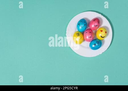 cute easter eggs with funny faces, top view Stock Photo