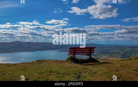 Bench at the top of Slieve Martin in Northern Ireland, looking across to the Ring of Gullion in the distance and the Cooley Mountains in Ireland Stock Photo