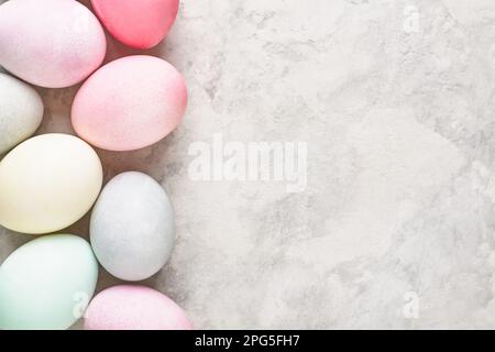Easter background, colorful pastel dyed Easter eggs border. Stock Photo