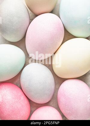 Easter background, colorful pastel dyed Easter eggs close up. Stock Photo