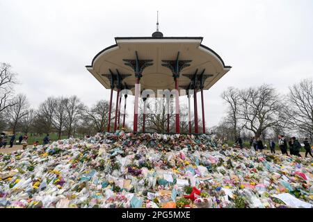 FILE - Floral tributes and messages surround the bandstand on Clapham Common in London, March 20, 2021, after the nearby disappearance of Sarah Everard. An independent review says London police have lost the confidence of the public because of deep-seated racism, misogyny and homophobia. The review released Tuesday March 21, 2023, was commissioned after Sarah Everard was raped and killed by a serving officer. (AP Photo/Alberto Pezzali, File)