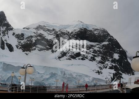 Passing through the narrow Lemaire Channel in Antarctica on a cruise ship Stock Photo