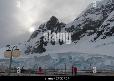 Passing through the narrow Lemaire Channel in Antarctica on a cruise ship Stock Photo