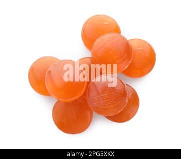 Many orange cough drops on white background, top view Stock Photo