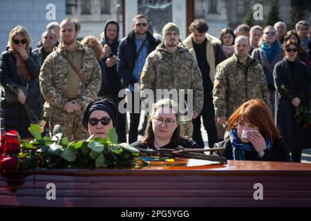 Kyiv, Ukraine. 20th Mar, 2023. Relatives mourn at the coffin with the body of Bizhan Sharopov, Ukrainian serviceman and widely known biologist during his funeral ceremony at the Independence Square in Kyiv. Credit: SOPA Images Limited/Ģ����ý Live News Stock Photo