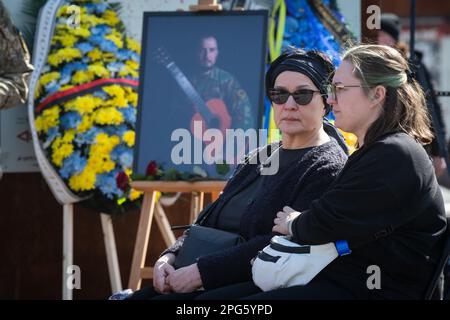 Kyiv, Ukraine. 20th Mar, 2023. Relatives mourn near the portrait of Bizhan Sharopov, Ukrainian serviceman and widely known biologist during his funeral ceremony at the Independence Square in Kyiv. (Photo by James McGill/SOPA Images/Sipa USA) Credit: Sipa USA/Ģ����ý Live News Stock Photo