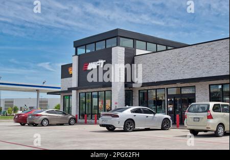 Houston, Texas USA 03-19-2023: Swift gas station and convenience store storefront exterior with parked vehicles in Houston, TX. Stock Photo