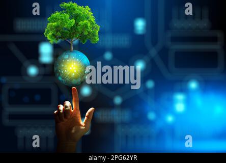Hand pointing growing tree on digital ball with technological convergence blue background. Innovative technology, Nature technology interaction. Stock Photo